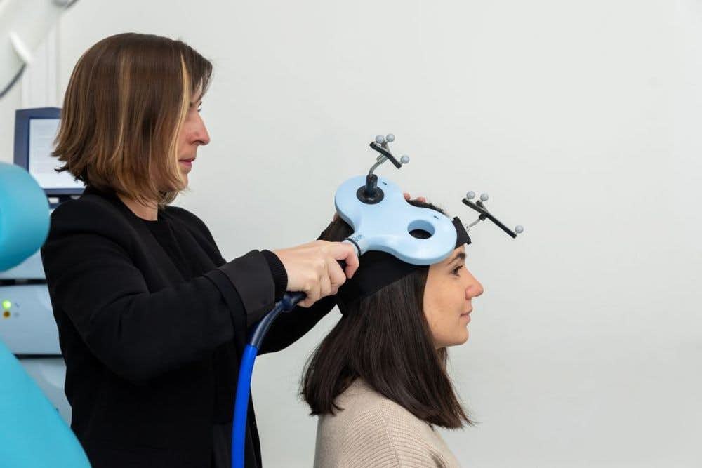 Psychiatrist Performing Transcranial Magnetic Stimulation (TMS) Therapy for Depression